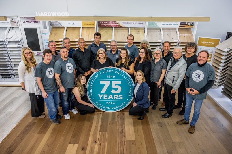 Staff photo in the hardwood section from 2024 for our store's 75th anniversary